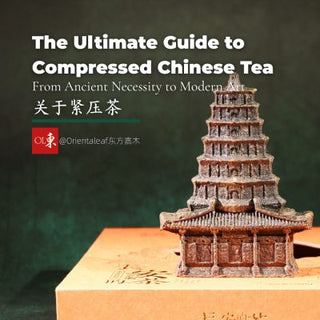 Compressed Chinese tea brick shaped like a miniature pagoda (Big Wild Goose Pagoda shape), resting on an orange box.