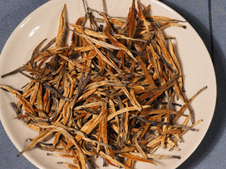Dry tea leaves of Golden Buds Classic Dianhong Black Tea