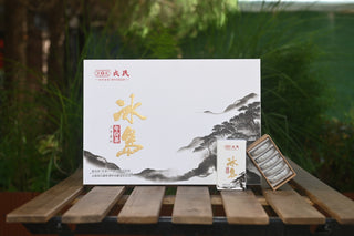 Mengku Rongshi 2020 Bingdao Aged Raw Pu-erh coin cake gift set with opened small box showing 5 coins.