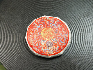 Fortune 2021 sun-dried Fuding Shou Mei 50g mini cake in its paper wrapper, red Fu character seal on top, resting on a wooden tray.
