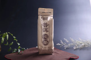 Traditional paper packaging of 2024 Spring Lincang Ripe Pu-erh Tea Tuo showing authentic Chinese branding.