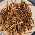 Dry tea leaves of Golden Buds Classic Dianhong Black Tea