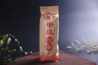 Front view of 2024 Premium Raw Pu-erh Tuo Cha in traditional paper packaging from Yunnan.