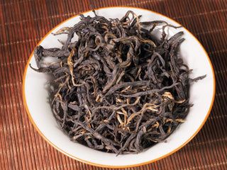 Close-up texture of 100-year-old arbor Dianhong black tea leaves