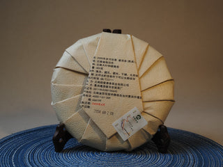 Back wrapper and traditional cotton paper packaging of 2005 Lincang ripe Pu-erh tea cake