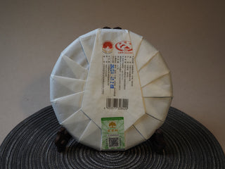 Back wrapper and official authentication label of 2025 Tan Chun Lincang raw Puerh tea cake.