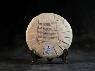 Back view of Bulang Mountain Ancient Tree Ripe Pu-erh tea cake packaging, displaying product details and traditional Bulang Mountain origin