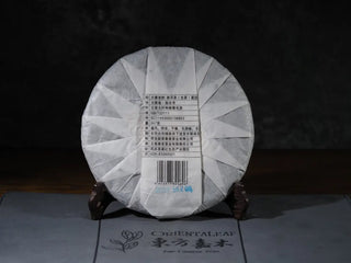 Back view of 2018 Dazhai Ancient Tree Raw Pu-erh Tea Cake with packaging, showing product details