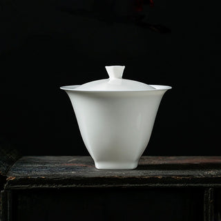 Elegant handcrafted Chinese white porcelain tea bowl with lid, studio shot