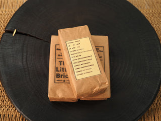 Back label of The Little Brick fu brick tea wrapper showing Jingyang origin, 100g net weight and August 2018 production date
