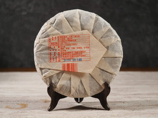 Back packaged view of Value Classic 2008 Tribute Sheng Pu-erh Tea Cake – 357g Menghai (2019 Pressed), highlighting wrapper details and batch info