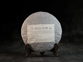 Front view of the inner wrap of Bulang Mountain Ancient Tree Ripe Pu-erh tea cake, preserving premium spring tea leaves
