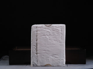 The 2019 vintage Fu Brick tea safely wrapped in white inner paper, ready for long-term aging and storage.
