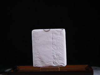 The 2018 vintage Fu Brick wrapped in traditional white paper to protect the Golden Flora (Eurotium Cristatum).
