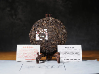 Unwrapped Sticky Rice Aroma Raw Pu-erh Cake 2013 200g displayed with neifei inner ticket