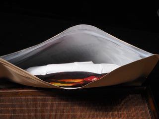 Close up view of aluminum foil lining inside kraft paper tea pouch