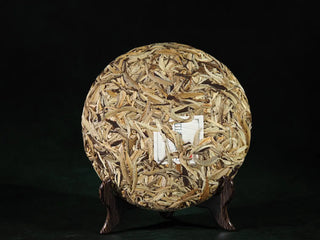 Front unwrapped view of 2023 Jinggu Yunnan Silver Needle White Tea Cake – Bai Hao Yin Zhen