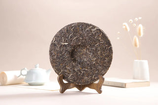 The reverse side of the compressed Lincang tea disc, showcasing uniform tea leaf compression for aging.