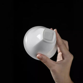 Close-up view of the base of the white porcelain gaiwan showing premium texture