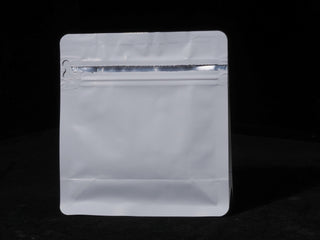 Professional tea packaging pouch with a clear view window and secure resealable foil barrier.