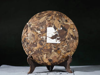 Front view of Yunnan High Mountain Wild Ancient Tree Shoumei White Tea Cake (2019) without packaging