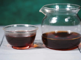 Display of the rich, thick, red-brown tea liquor of the 2014 Aged Liubao Dark Tea, featuring the Betel Nut Aroma and Cooling Finish.