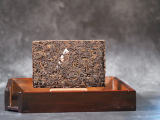 Detailed surface texture of aged 2019 Xiaguan Baoyan shou Puerh leaves.