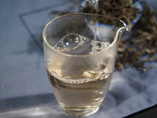 Clear, bright golden liquor of Ailao Yellow Tea with notes of toasty honey and sweet potato.