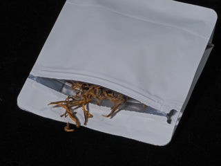Loose leaf tea leaves stored inside a premium heat-sealable aluminum foil protection bag for maximum freshness.