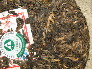 Detail of the brand's authenticity Neifei label on a 2006 Mangbo tea cake.