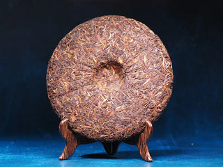 Back view of Spring Ming 2017 Aged Sheng Pu-erh Tea Cake – 400g (Lincang, Yunnan) showing texture and quality of compressed tea leaves.