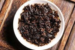 Wet tea leaves after brewing, showing the premium Imperial leaf grade texture