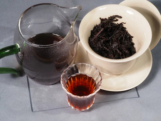 A complete Gongfu tea set display with 2013 Aged Liubao Dark Tea, presenting a warming, digestive wellness tea experience from Wuzhou.