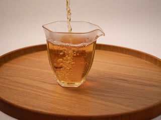 Clear golden liquor of freshly brewed Yunnan Golden Empress Oolong tea