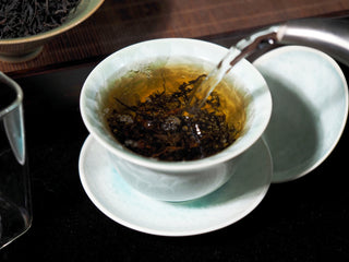Pouring hot water over Wild Wilderness Dianhong black tea leaves