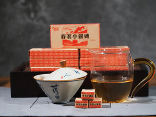 Complete tea setup with gaiwan, Gongdao cup, and Yunnan Mini Raw Pu-erh Tea Brick boxes, illustrating traditional Chinese tea preparation