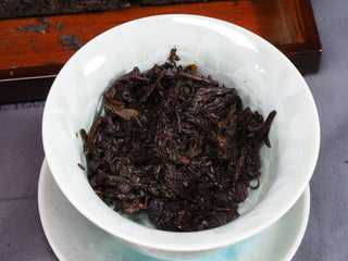 Wet, dark fermented tea leaves of the 2018 Fu Brick after several infusions, showing high leaf quality.
