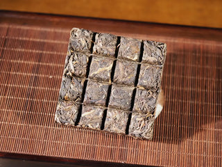 Top view of Yunnan Raw Pu-erh Waffle Cake – Three Legendary Leaves brick divided into 16 small waffle squares, approx. 5g each