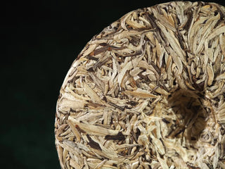 Close-up of compressed leaf pattern on the back of 2023 Jinggu Silver Needle White Tea Cake
