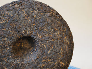 Inner nest depression detail of the compressed 2005 Lincang Shou Pu-erh tea cake
