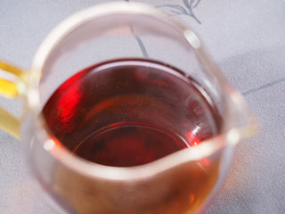 Clear, rich amber tea liquor of the 2013 vintage Fu Brick, demonstrating the smooth maturation of aged dark tea.

