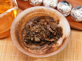 Thick and durable wet leaves of wild ancient tree Puerh, showing 18 years of aging quality.