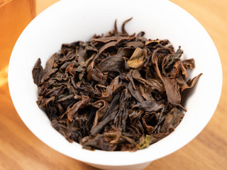 Close-up of naturally twisted Yunnan Golden Empress Oolong tea leaves