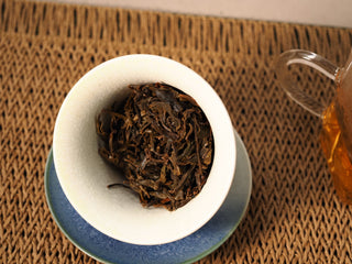 Wet leaves of Jing Chang Hao Bada Ancient Trees 2013 raw Pu-erh in a gaiwan after steeping, large soft oil-bright leaf