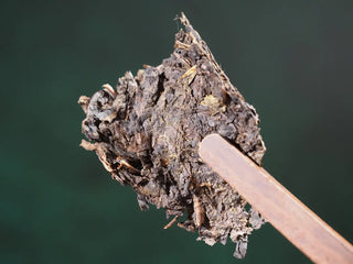 A piece of the Master-Crafted Fubrick being easily broken off by hand, highlighting the easy-to-pry feature.