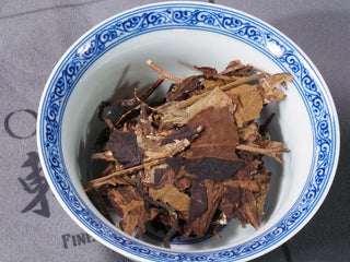 Small piece of Yunnan High Mountain Wild Ancient Tree Shoumei White Tea Cake (2019) placed in a gaiwan, ready for brewing