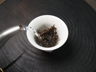 2020 Dazhai Ancient Tree Raw Pu-erh Tea – Bright Clear Yellow Liquor in White Porcelain Cup Showcasing Premium Tea Quality
