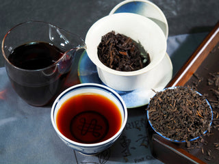 Complete 2006 Aged Liubao tea set showing dry leaves, wet leaves, and the tea soup.