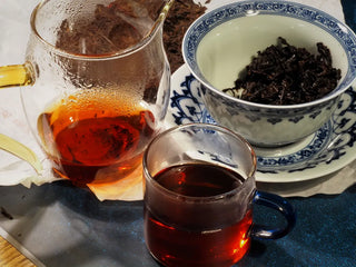 Close-up of fully opened infused leaves from Yunnan Red Glow Ripe Pu-erh Tea Mini Cake – 100g, displaying the tender high-mountain tea leaf texture after steeping.