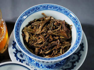 Close-up of brewed leaves of Ancient Arbor Harmony Raw Pu-erh Tea showing the tenderness and freshness of ancient tree leaves.